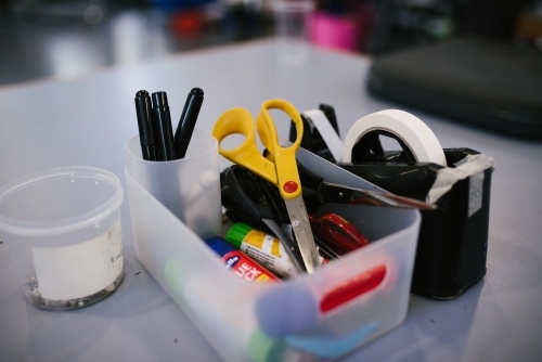 School supplies including scissors, tape, glue and pens