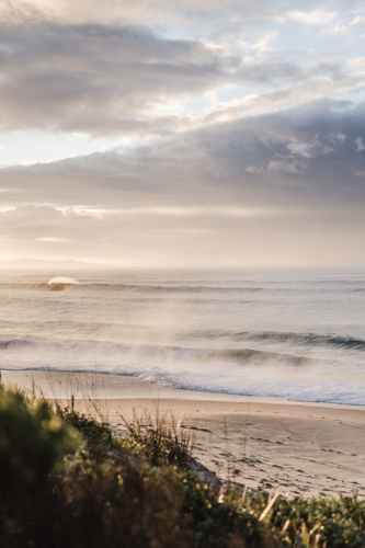 Sea mist on sunrise waves - Australian Stock Image