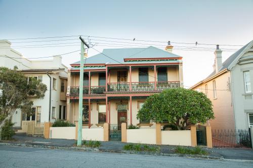 Seaside houses and power lines with birds on them - Australian Stock Image