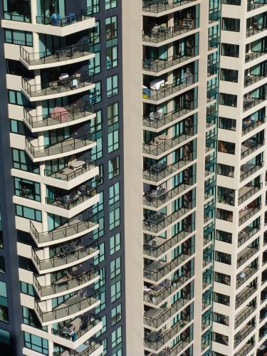 Section of a high rise building with window and balcony detail - Australian Stock Image