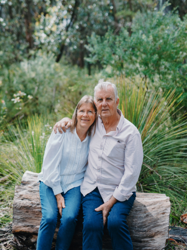 senior couple sitting together enjoying healthy lifestyle in Australian bushland - Australian Stock Image