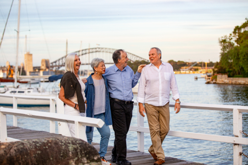 Senior couples walking on the pier at Sydney harbour - Australian Stock Image