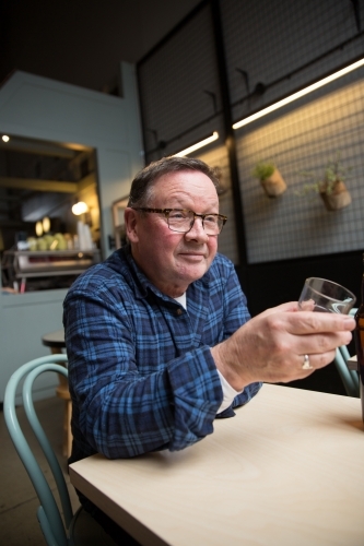 Senior Man in Coffee Shop - Australian Stock Image