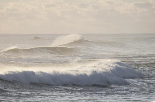 Set of waves rolling in a big swell - Australian Stock Image