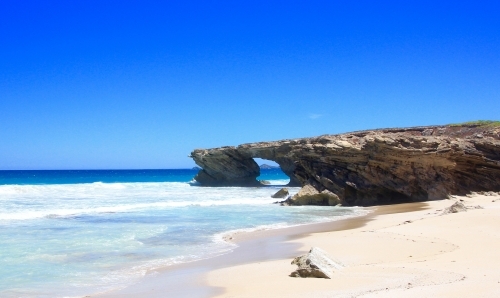 Shark Fin Doorway and sunlit beach - Australian Stock Image
