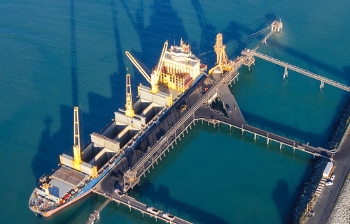 Ship laying in dock being loaded up at Mackay Port - Australian Stock Image