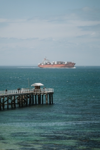 Ship passing pier - Australian Stock Image