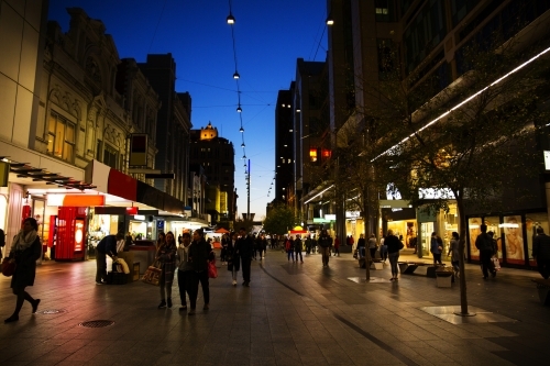 Shoppers in Mall at night with dark sky - Australian Stock Image