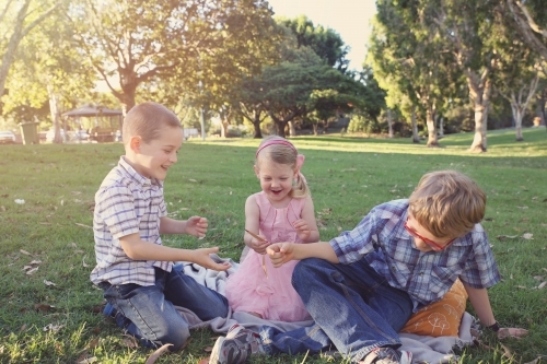 Sibling playing in the park - Australian Stock Image