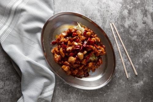 Sichuan kung pao chicken dish on table