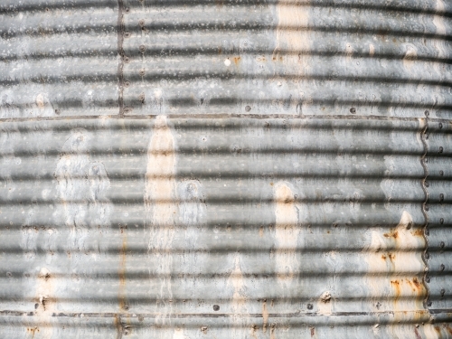 Side of an old, leaky corrugated iron water tank - Australian Stock Image