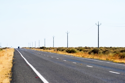 Side of road in a dry, barren land. - Australian Stock Image