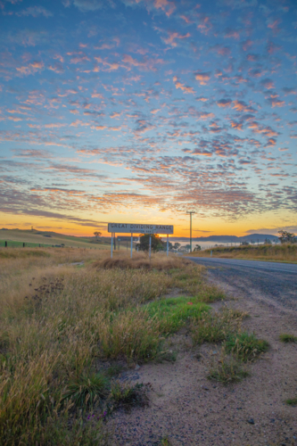 sign on early morning beside country road - Australian Stock Image