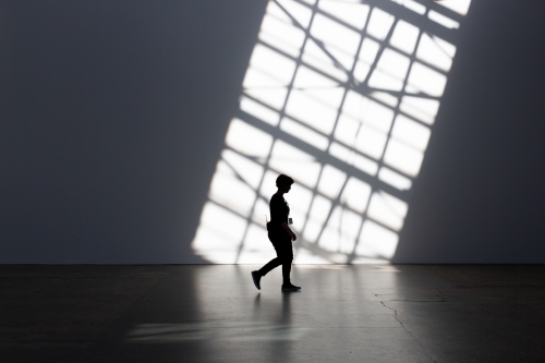 Silhouette of person and shadows at Carriage Works, Sydney