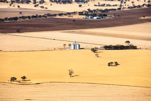 Silos and agricultural land in the Wimmera area of Western Victoria - Australian Stock Image