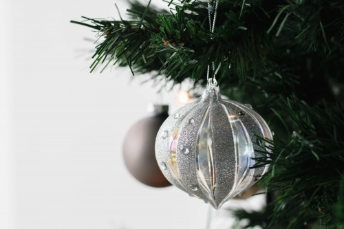 Silver Glass Bauble on Christmas Tree - Australian Stock Image