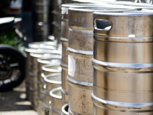 Silver metal beer kegs - Australian Stock Image