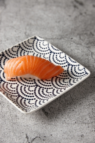Single nigiri on square plate - Australian Stock Image