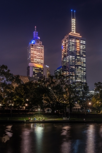 sitting under a light on the edge of the Yarra River, Melbourne - Australian Stock Image