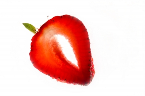 sliced strawberry on white background - Australian Stock Image