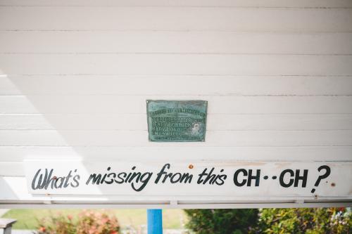 Slogan outside church: what's missing from this church? - Australian Stock Image