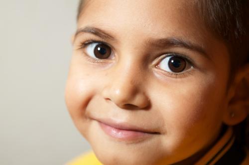 Smiling Aboriginal Boy in Close-up - Australian Stock Image