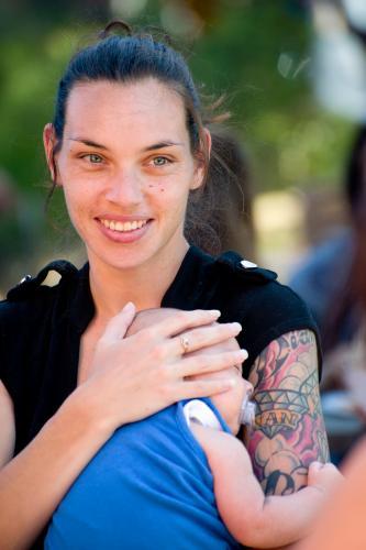 Smiling Aboriginal Mother with Baby - Australian Stock Image