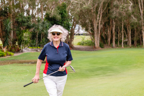 Smiling Senior Golfer on the Fairway - Australian Stock Image