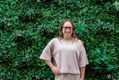 smiling woman, from a series featuring a young woman with Down Syndrome - Australian Stock Image