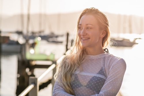 smiling woman in the afternoon sun - Australian Stock Image