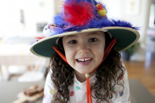 Smiling young girl with hand made Easter hat - Australian Stock Image