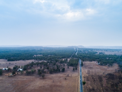 Smoke filled hazy skies over landscape near Putty - Australian Stock Image