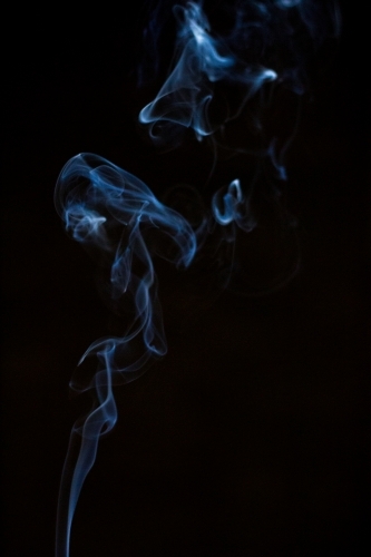 smoke suspended in darkness