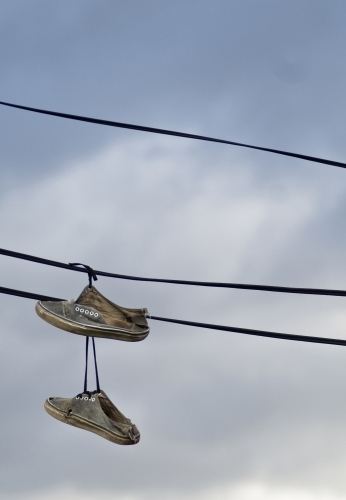 Sneakers hanging off electrical wires