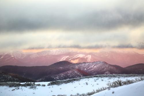 Snowy mountains at sunset