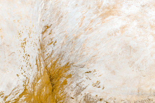 Soft ochre tones and white textures in abstract salt patterns - Australian Stock Image