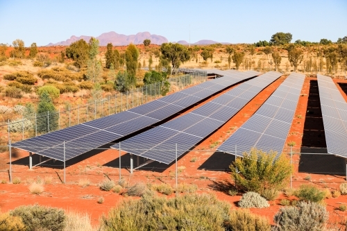 Solar panel farm in outback destination beneath blue sunny sky