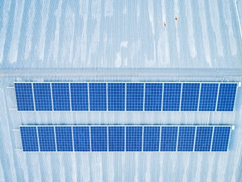 Solar Panels on tin roof of farm shed viewed from above - Australian Stock Image