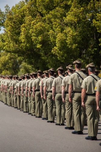 Soldiers marching down the road