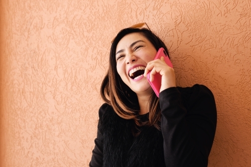Southeast Asian multicultural woman on the phone - Australian Stock Image
