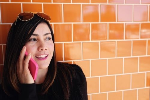 Southeast Asian multicultural woman on the phone - Australian Stock Image