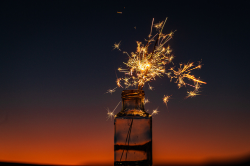 Sparklers in a jar fully ignited at sunset - Australian Stock Image