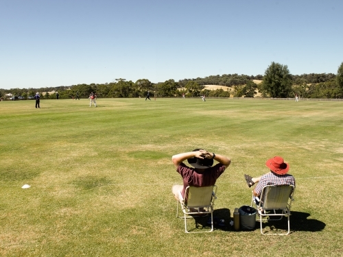 Spectators at a T20 cricket match in the country - Australian Stock Image