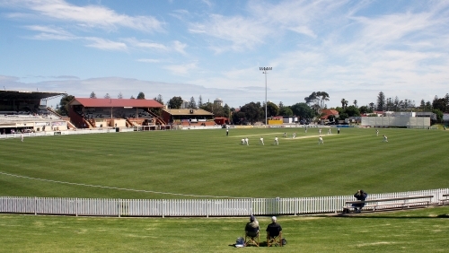 Spectators watching a cricket game - Australian Stock Image