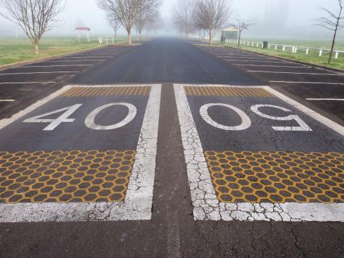 Speed signs printed on the road - Australian Stock Image