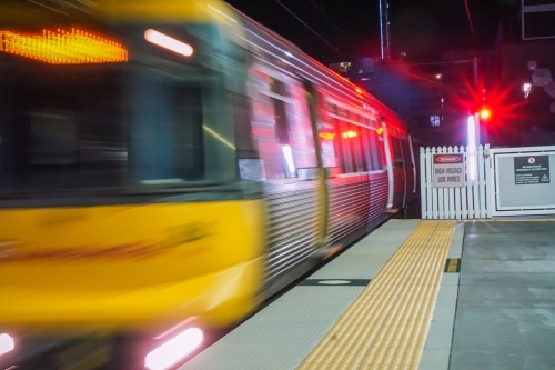 Speeding train pulling into station - Australian Stock Image