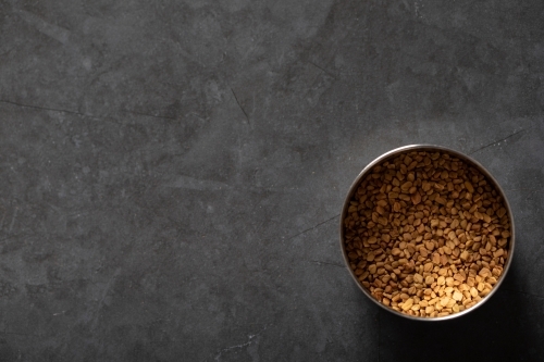 Spice tin of fenugreek seeds - Australian Stock Image
