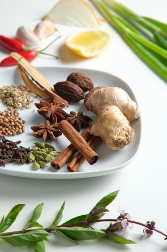 Spices and herbs on white table