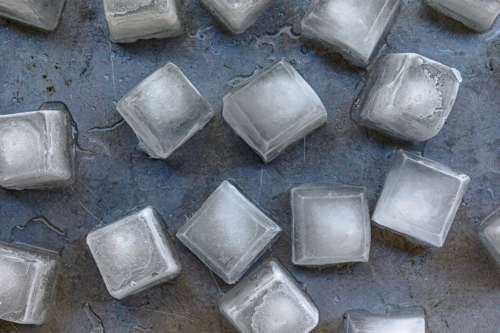 Square icecubes on a silver background - Australian Stock Image