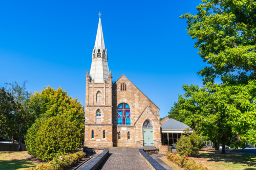 St Paul's Lutheran Church Hahndorf built in 1890 viewed from the main street on a sunny day - Australian Stock Image